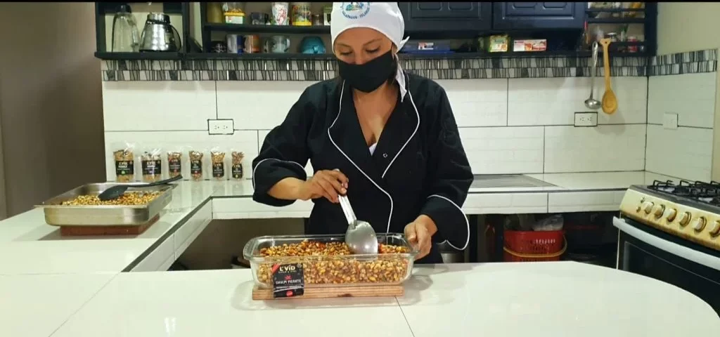 Tania Quisingo mixing Chulpi and spices