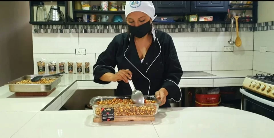 Tania Quisingo mixing Chulpi and spices