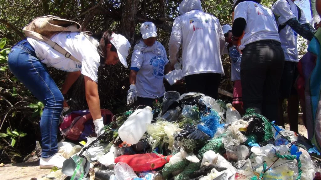 Students participating on beach clean up