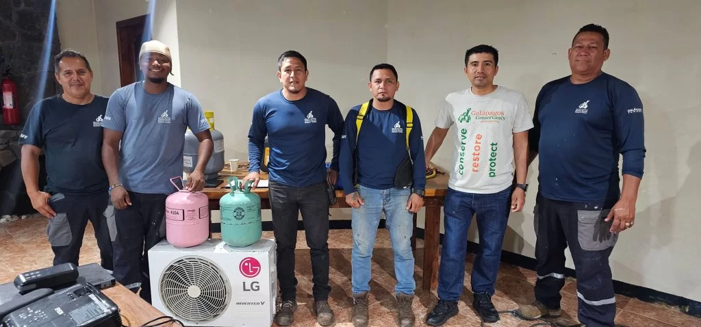 Staff from the Charles Darwin Foundation and Galo pose after a vital training session on proper refrigerant gas management.