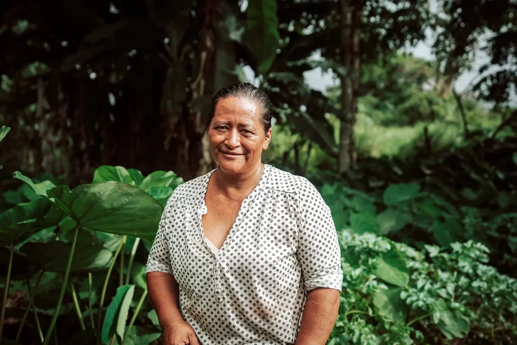 Noemí Rea's radiant smile showcases her passion for sustainable development by planting and harvesting organic produce locally.