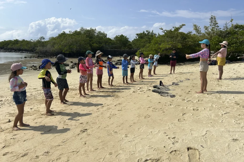 Children on the beach at Tortuga Bay ©Galapagos Conservancy