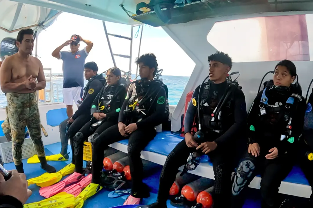 Scouts receive pre-dive instructions to ensure they are well-prepared for their underwater experience.