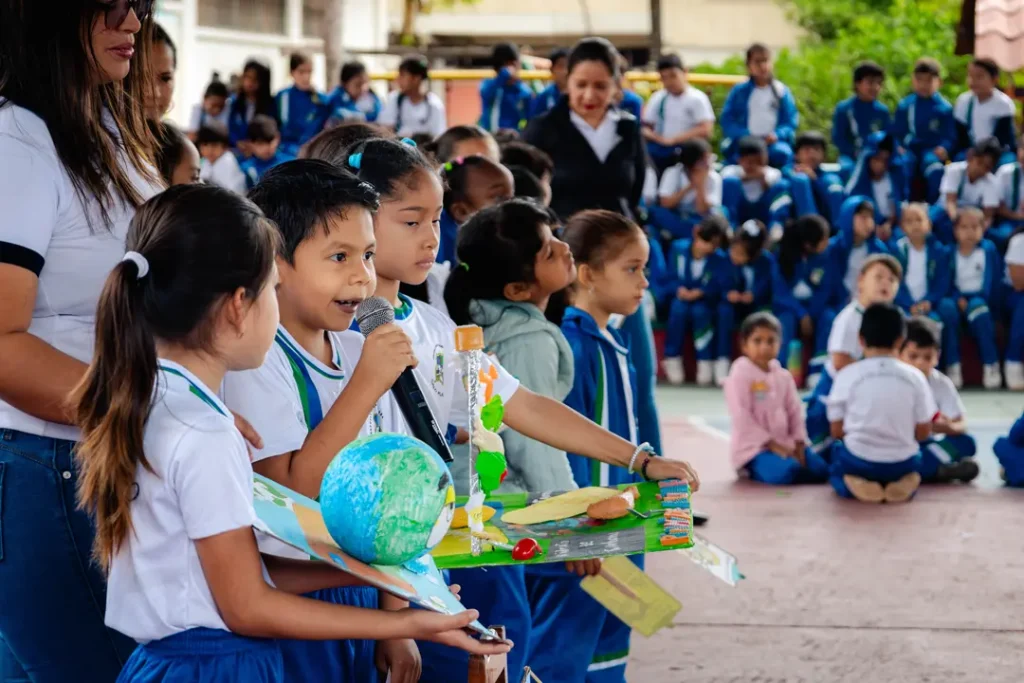 Children from Galo Plaza School in Santa Cruz present their projects on protecting the planet.